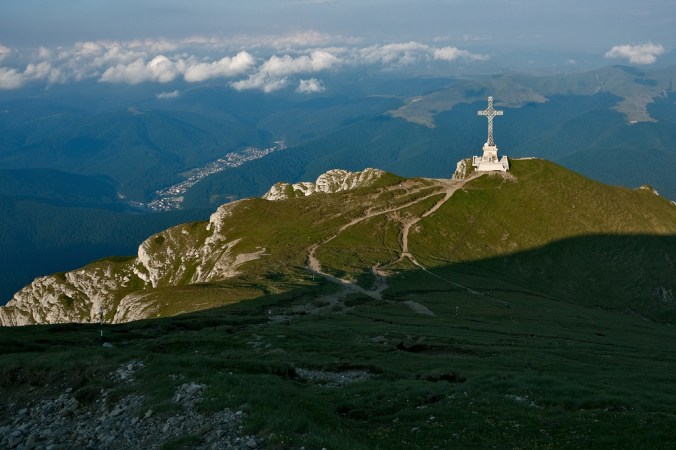 Mountain pathways leading down to cross monument