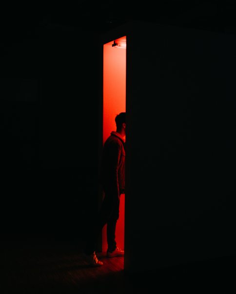 person-standing-on-opened-doorway-2276051